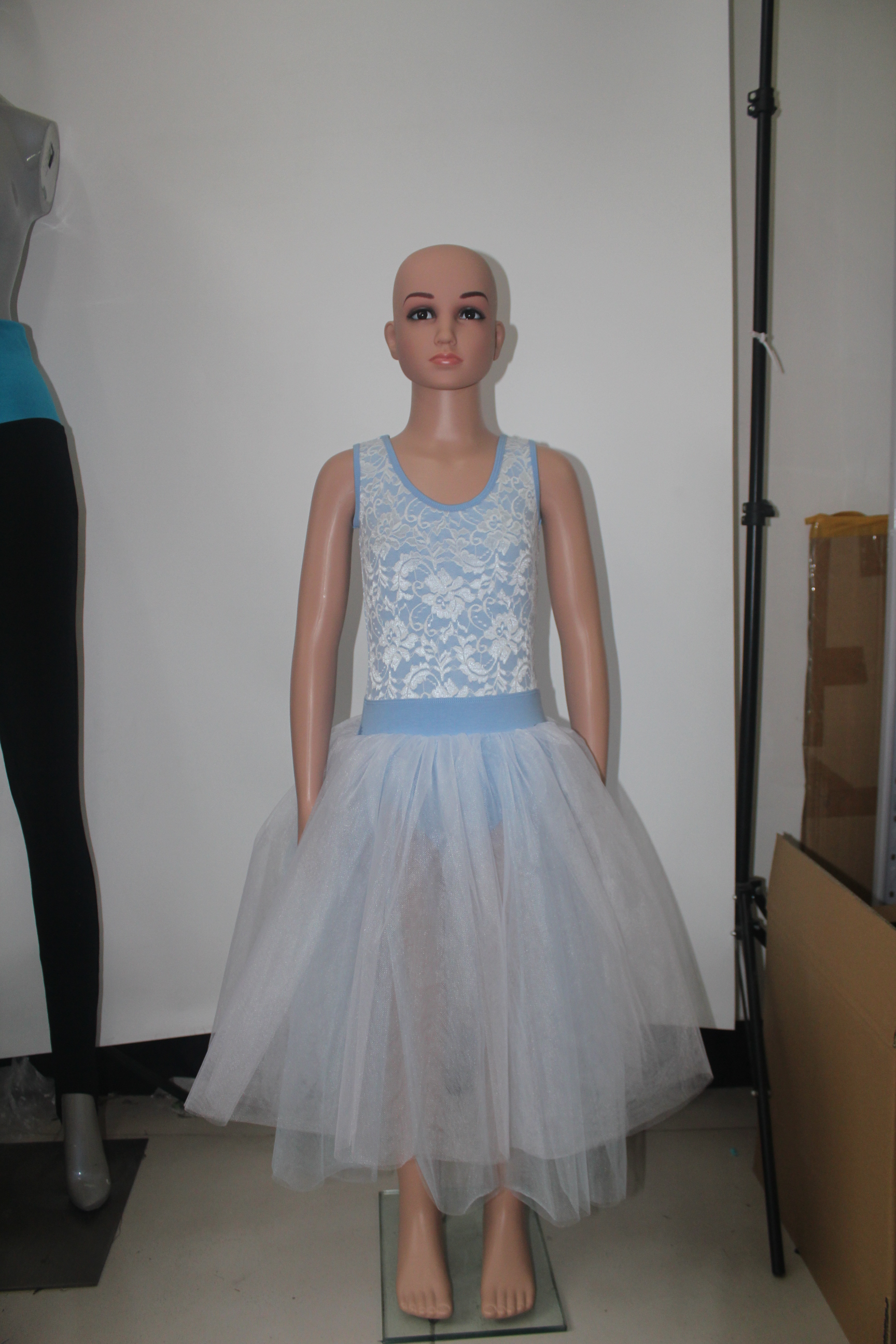We received the latest shipment with the metallic blue dress and the lace dress that you made for us with the sky blue and white lace bodice with tulle skirt. Everyone LOVES the blue and white dress, it is very beautiful. And the metallic blue one is a lot of fun for one of our jazz classes. We are currently sizing the girls for these costumes and will place an order soon.
Thank you.
Rebecca